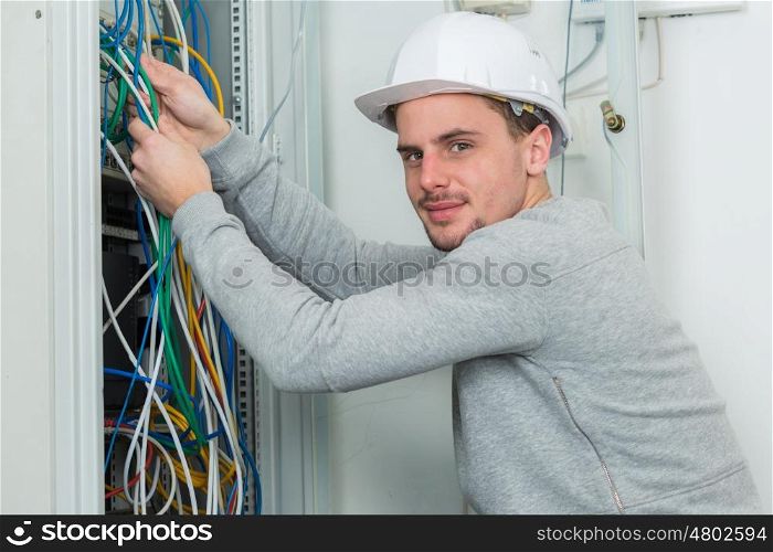 a man working on electric wire