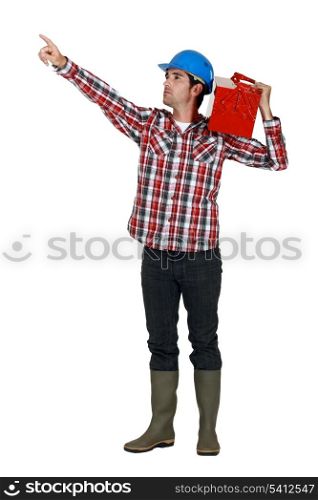 A manual worker pointing at something.