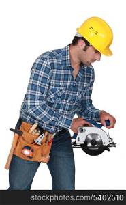 A manual worker with a circular saw.