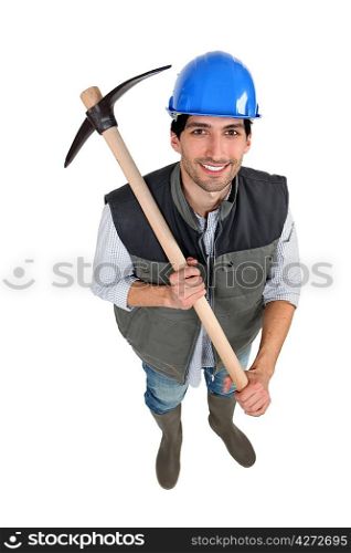 A manual worker with a pickaxe.