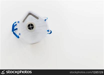 A mask for coronavirus protection with copyspace on white background
