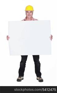 A mature architect holding a blank poster.