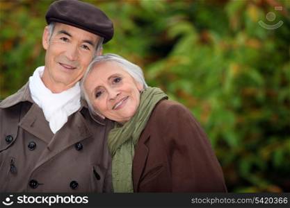 A mature couple in a park.