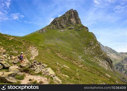 a mature woman hiking in the Pyrenees mountains