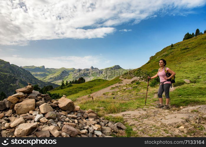 a mature woman hiking in the Pyrenees mountains