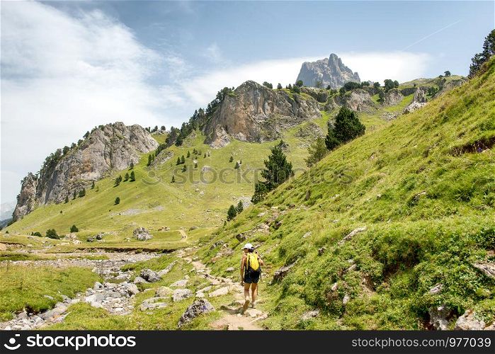 a mature woman hiking in the Pyrenees mountains