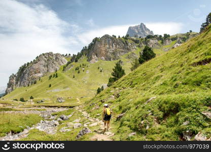 a mature woman hiking in the Pyrenees mountains