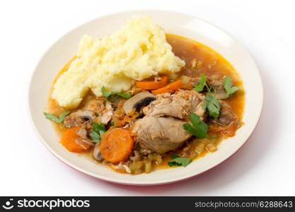 A meal of chicken cacciatore, braised chicken cooked with tomato, celery, carrot, onion, mushrooms and stock and served with mashed potatoes.