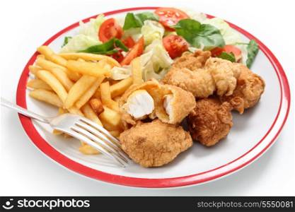 A meal of homemade kingfish nuggets served with french fried potato chips and a salad of tomato, lettuce and rocket, with a fork
