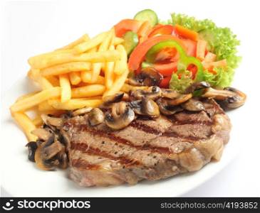 A meal of steak with mushrooms, french-fried potatoes and salad.