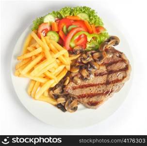 A meal of steak with mushrooms, french-fried potatoes and salad viewed from above.