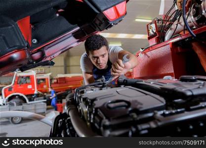 a mechanic repairing construction vehicle