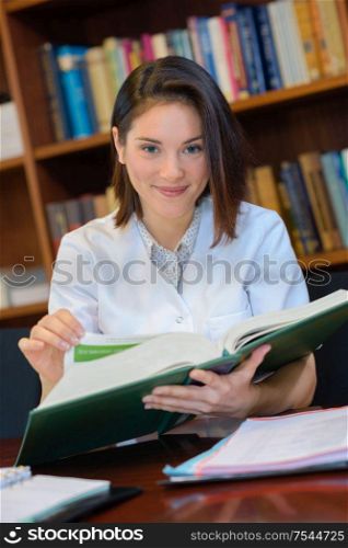 a medic looking through book