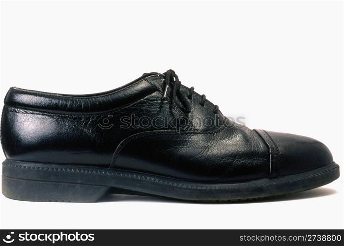 A men&rsquo;s black shoe isolated on white background