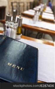 A menu laid on a restaurant table