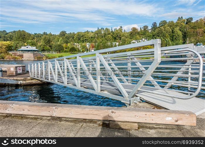 A metal ramp spans sections of the pier at Coulon Park in Renton, Washington.