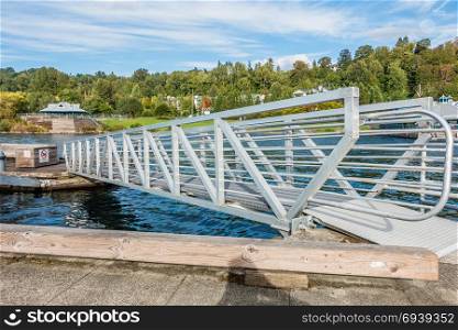A metal ramp spans sections of the pier at Coulon Park in Renton, Washington.