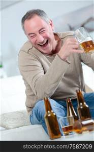 a middle age man drinking beer