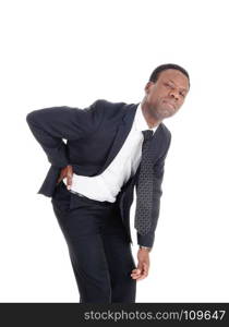 A middle age man in a suit holding hisback for back pain, isolated for white background