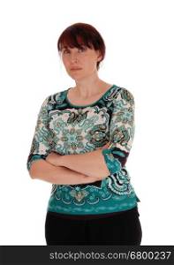 A middle age woman looking very serious, standing with her arms crossed isolated for white background.