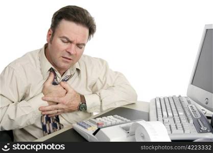 A middle aged man having chest pains or indigestion at work.