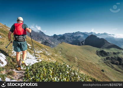 A middle-aged man on trail during a mountain endurance trail