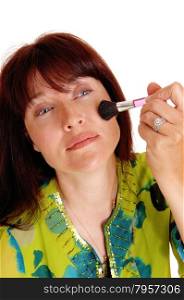 A middle are woman applying makeup on her chic&rsquo;s, in closeup, isolatedfor white background.