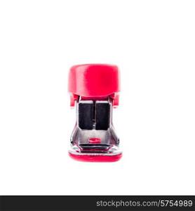 A miniture red stapler viewed from the front on a white background.