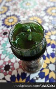 A Minttea in a teahouse in the old City in the historical Town of Fes in Morocco in north Africa.. AFRICA MAROCCO FES