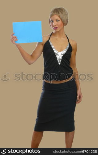 A model poses with a card for text insertion.