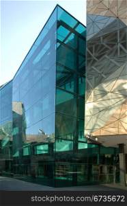 A modern inner-city building with its glass facade