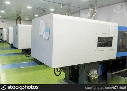 A molding machine in a factory for the production of medical syringes and droppers. Molding machine in a factory for the production of medical syringes and droppers