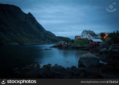A moody fishing village at dusk on Lofoten Island, above the arctic cirle in Norway