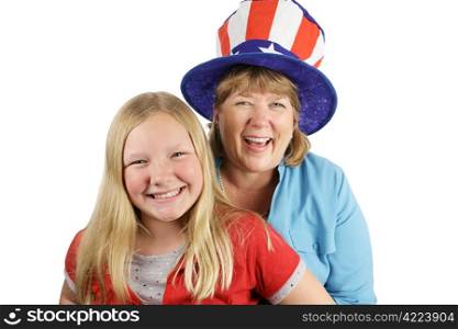 A mother and daughter dressed for fourth of july. The focus is on the mother in the hat, laughing. Isolated on white.