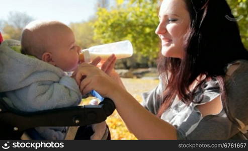 A mother feeding her baby