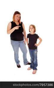 A mother standing behind her little daughter pointing her finger at herisolated for white background.