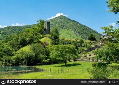 a mountain landscape with the ruins of a castle in the Pyrenees