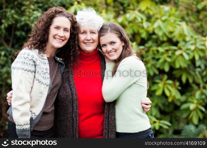 A multi generation portrait of a happy grandmother with her daughter and granddaughter