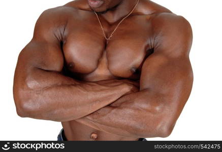 A muscles body of an African American man standing with his arms crossed and sweaty body, isolated for white background