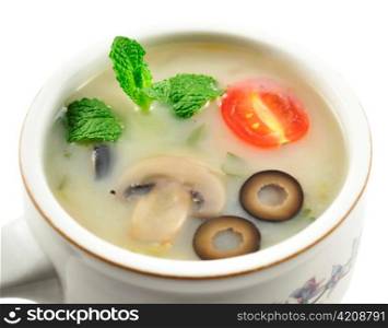 a mushroom soup in a soup cup