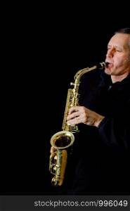 A Musician playing jazz music on his saxophone