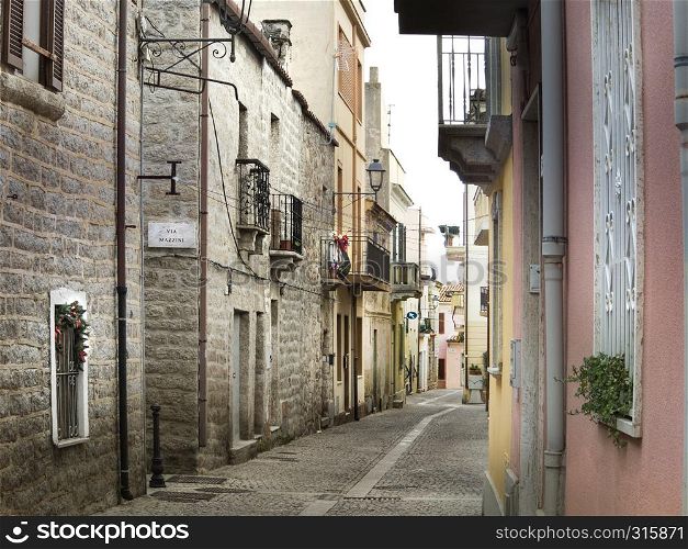 A narrow old town street in Olbia