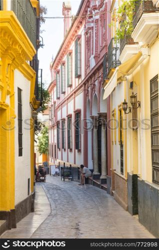A narrow street in Seville's old city