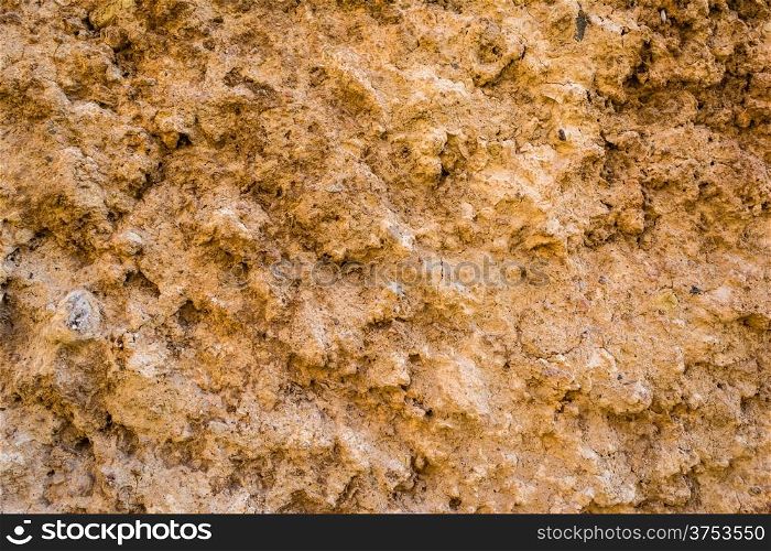 A natural wall of rough stone