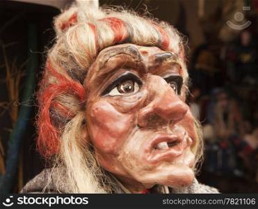 A near-lifesize head of a traditional Czech marionette in the likeness of a witch.