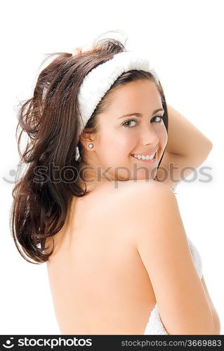 a nice brunette with white towel taking pose in front of the camera playing and smiling