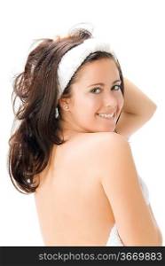 a nice brunette with white towel taking pose in front of the camera playing and smiling