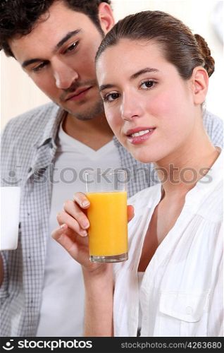 A nice couple having morning drinks.