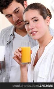 A nice couple having morning drinks.