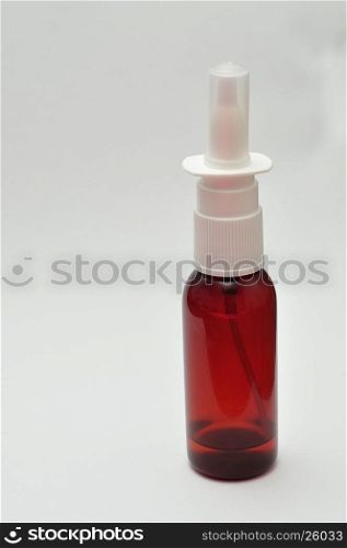 A nose spray bottle isolated on a white background